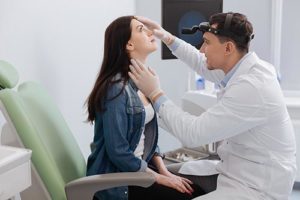 a doctor explaining to a patient how anesthesia for ear nose throat works