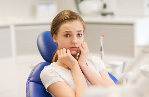 5 Ways SleepGuardian Can Help Ease Your Dental Fear woman thinking about how sleepguardian can ease your dental fear